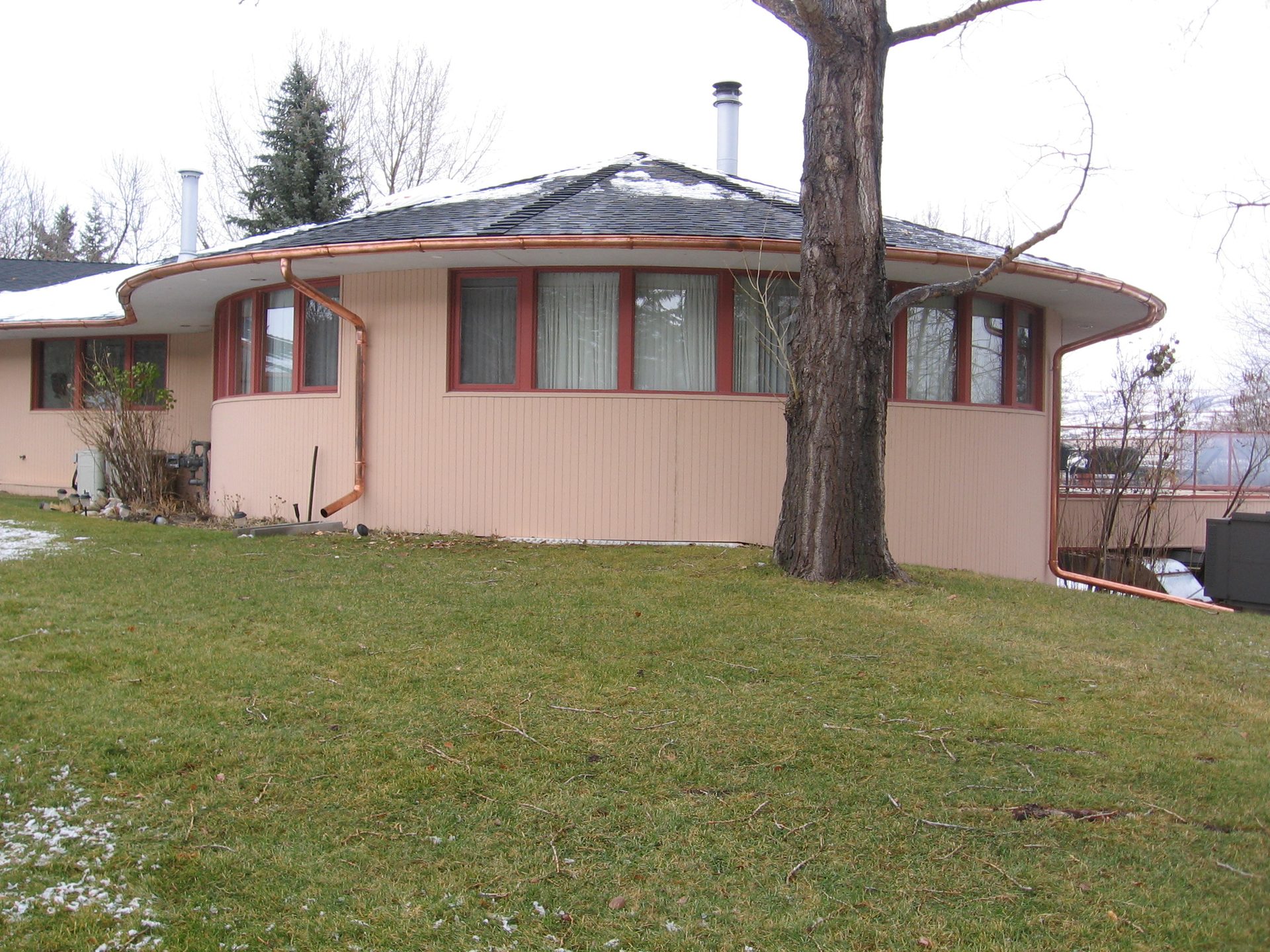 Custom eavestrough on a round home